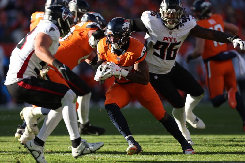 Javonte Williams #33 of the Denver Broncos runs for a second quarter touchdown against the Atlanta Falcons at Empower Field At Mile High on Nov. 17, 2024, in Denver, Colorado.