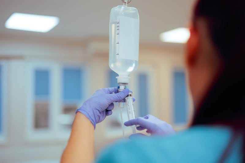 Nurse checking an IV