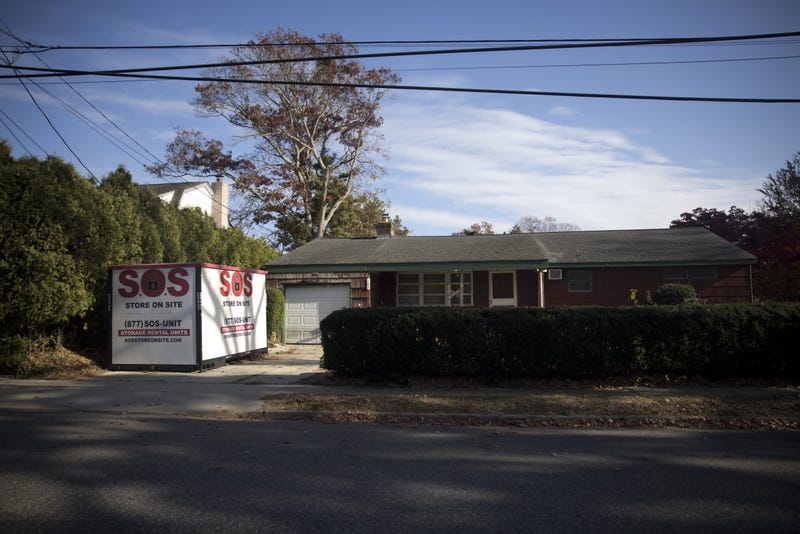 A moving container is seen outside accused serial killer Rex Heuermann's house in Massapequa Park, New York on November 20, 2024