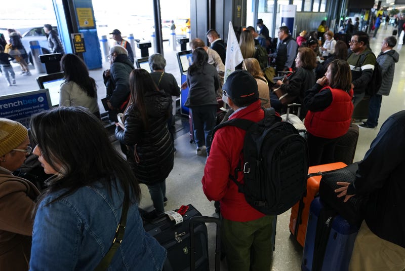 Travelers are seen at the Newark Liberty International Airport (EWR) on Nov. 26, 2024