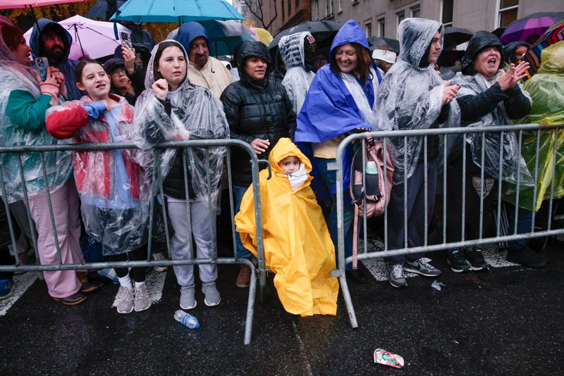 People watch the Annual Thanksgiving Day Parade on November 28, 2024 in New York City. This is the 98th Macy's Thanksgiving Day Parade which was first held in 1924 and only paused from 1942 to 1944 during World War II. (Photo by Kena Betancur/Getty Images)