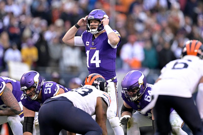 Sam Darnold #14 of the Minnesota Vikings calls a play from the line of scrimmage during overtime against the Chicago Bears at Soldier Field on November 24, 2024 in Chicago, Illinois.