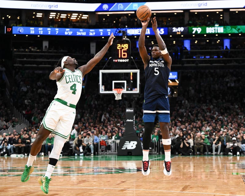 Anthony Edwards #5 of the Minnesota Timberwolves attempts a basket past Jrue Holiday #4 of the Boston Celtics during the third quarter at the TD Garden on November 24, 2024 in Boston.