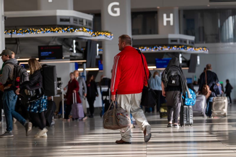 People enter LaGuardia Airport (LGA) on November 26, 2024