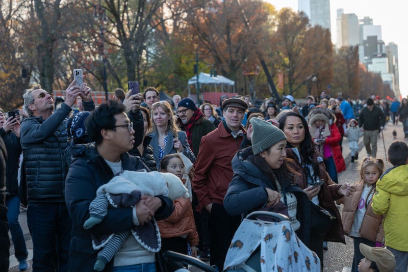 Onlookers watch as workers participate in the annual balloon inflation for the 2024 Macy's Thanksgiving Day Parade on Nov. 27, 2024 in New York City.