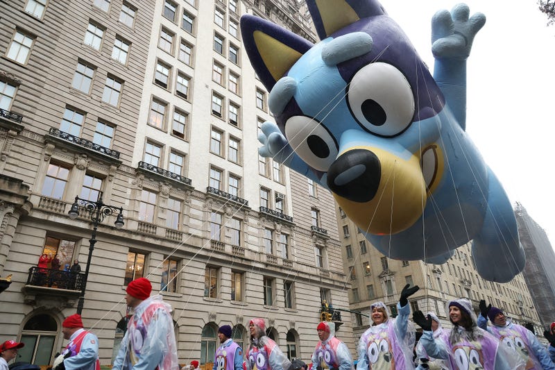The Bluey balloon team march during the Annual Thanksgiving Day Parade on November 28, 2024 in New York City. This is the 98th Macy's Thanksgiving Day Parade which was first held in 1924 and only paused from 1942 to 1944 during World War II.