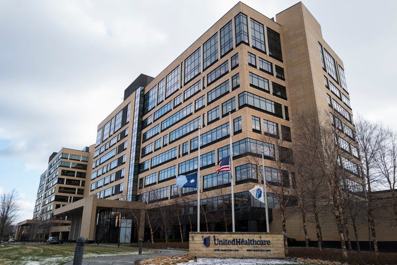 Flags fly at half mast outside the United Healthcare corporate headquarters on December 4, 2024 in Minnetonka, Minnesota