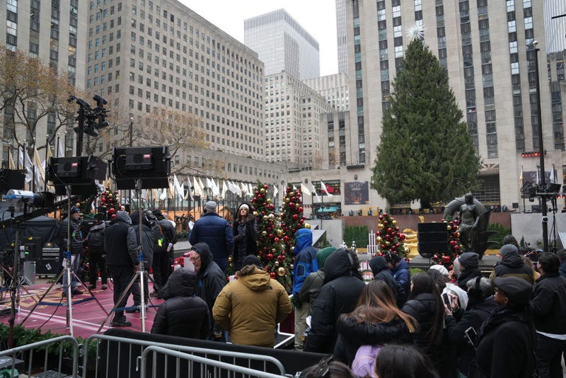 People gather near the stage ahead of Wednesday's 2024 Rockefeller Center tree lighting ceremony in New York on Dec. 4, 2024.