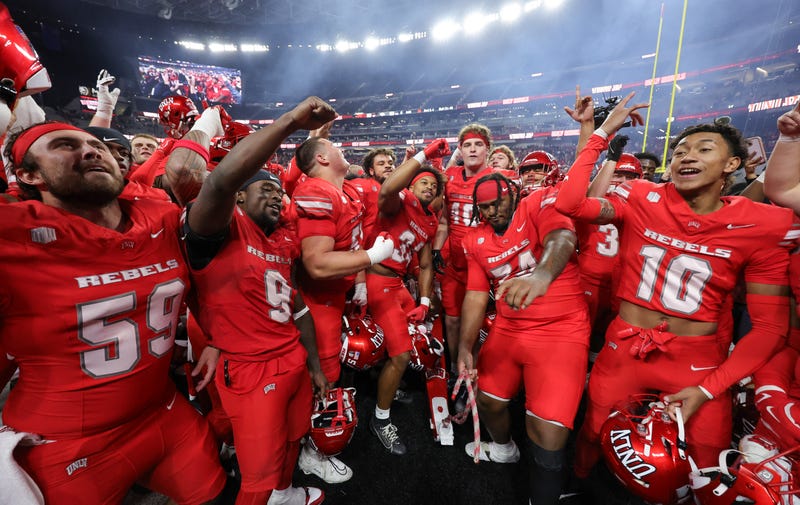 The UNLV Rebels celebrate on the field after the team's 38-14 victory over the Nevada Wolf Pack at Allegiant Stadium on November 30, 2024 in Las Vegas, Nevada. 