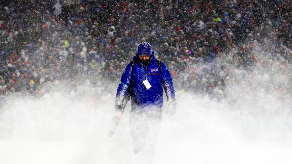 PHOTOS: Bills clinch 5th consecutive AFC East title in 'snow globe' game at Highmark Stadium in Orchard Park