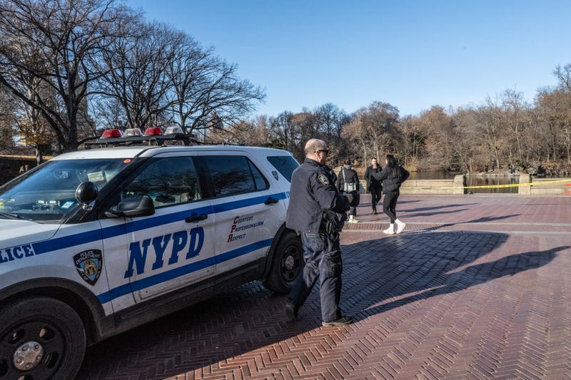 Police patrol near the pond being searched next to Bethesda Fountain in Central Park on December 8, 2024