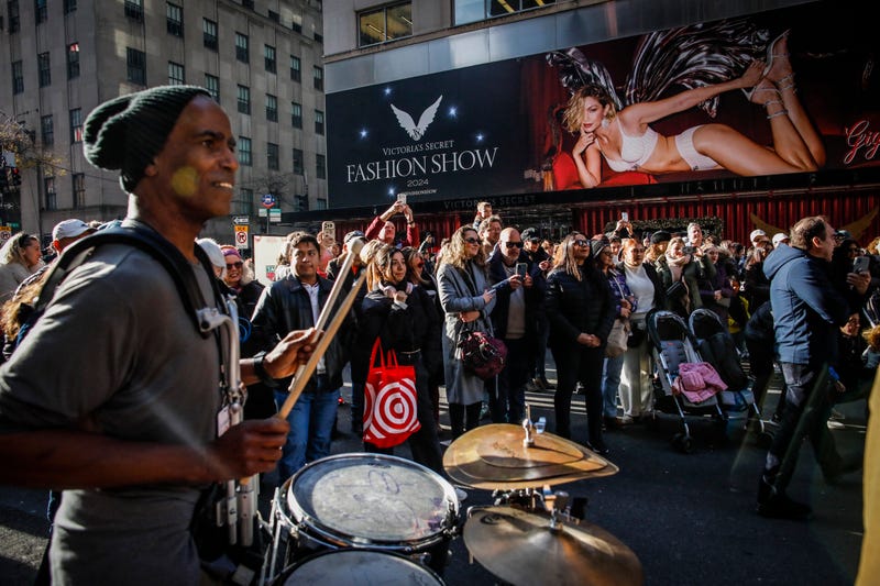 The worker was apparently removing this billboard of Gigi Hadid when he was knocked from the lift outside the flagship Victoria's Secret store on Fifth Avenue, seen here during a parade in December