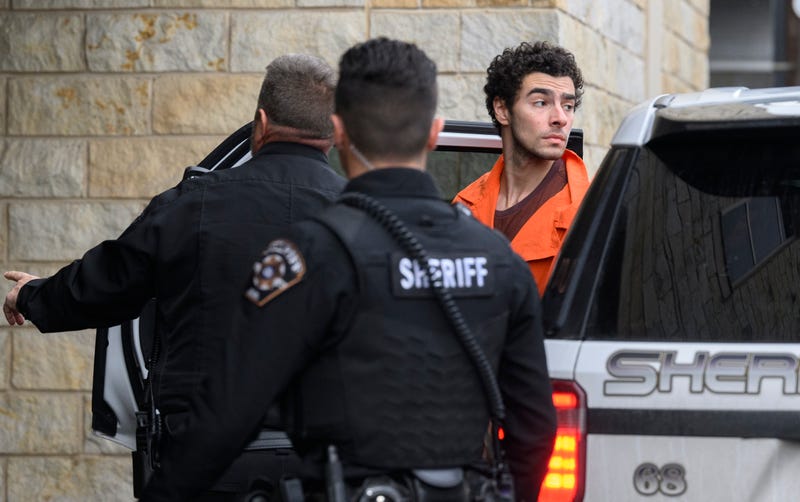 Suspected shooter Luigi Mangione is led into the Blair County Courthouse for an extradition hearing December 10, 2024 in Hollidaysburg, Pennsylvania