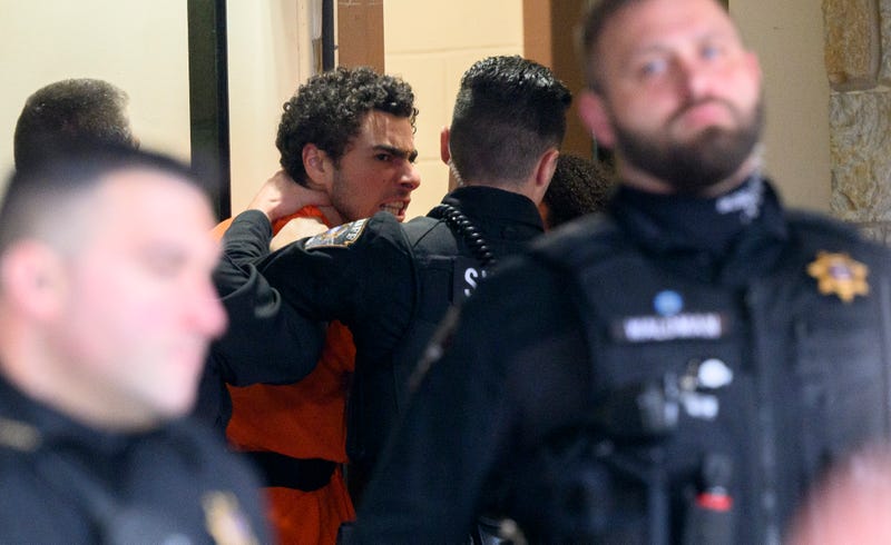 Suspected shooter Luigi Mangione is led into the Blair County Courthouse for an extradition hearing December 10, 2024