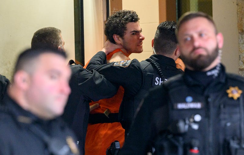 Suspected shooter Luigi Mangione is led into the Blair County Courthouse for an extradition hearing Dec. 10, 2024 in Hollidaysburg, Pennsylvania. Mangione has been arraigned on weapons and false identification charges related to the fatal shooting of United Healthcare CEO Brian Thompson in New York City. Mangione is incarcerated in the State Correctional Institution in Huntingdon, Pennsylvania awaiting extradition to New York. 