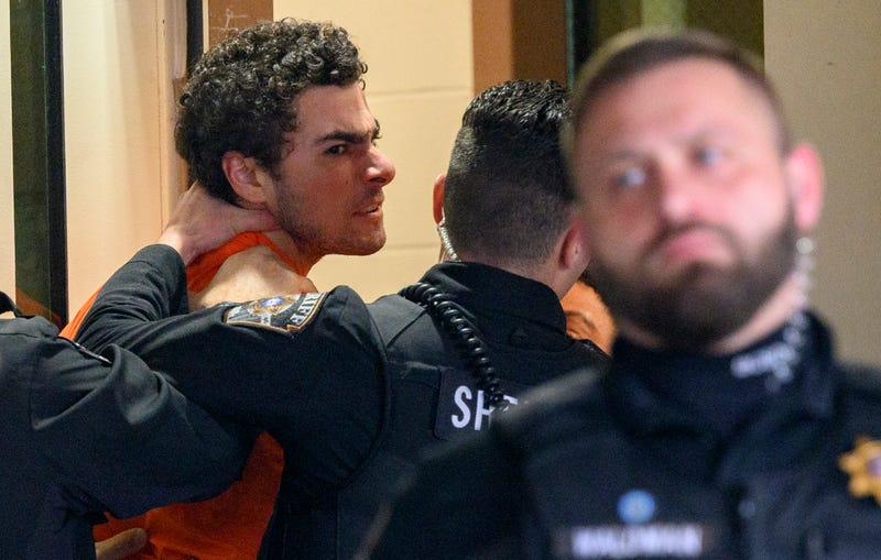 Suspected shooter Luigi Mangione is led into the Blair County Courthouse for an extradition hearing December 10, 2024