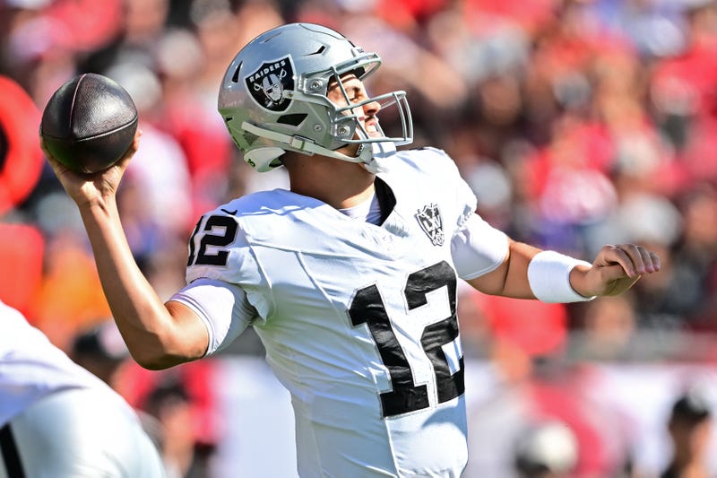 Aidan O'Connell #12 of the Las Vegas Raiders throws a pass during the first quarter against the Tampa Bay Buccaneers at Raymond James Stadium on December 08, 2024 in Tampa, Florida.