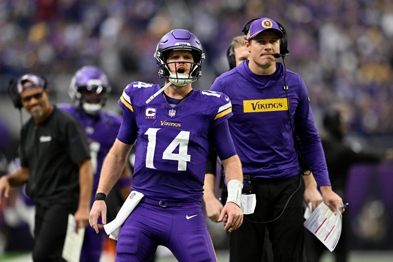 Sam Darnold #14 of the Minnesota Vikings reacts after throwing a touchdown pass against the Atlanta Falcons during the second quarter at U.S. Bank Stadium on December 08, 2024 in Minneapolis, Minnesota.