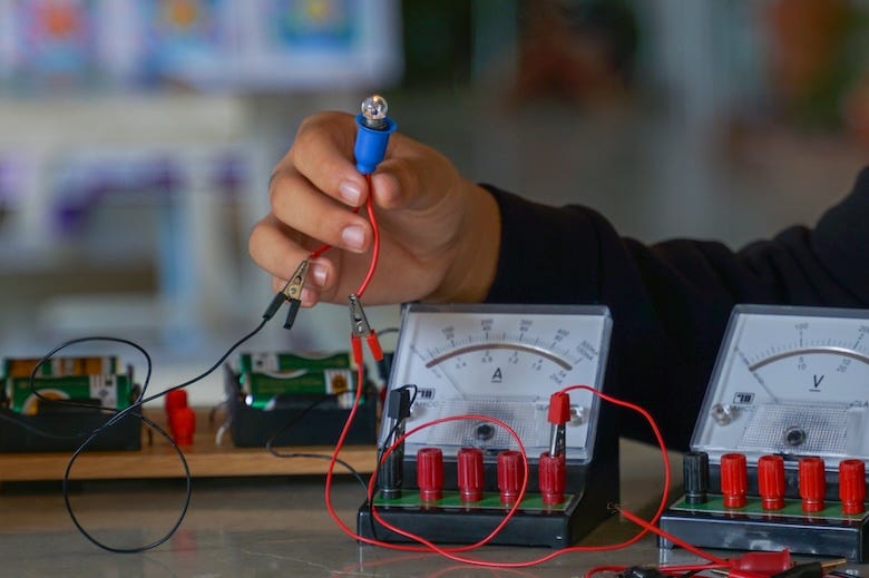 Teen boy working on a circuit board