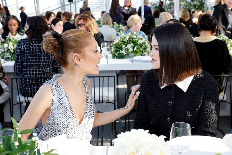 Ariana Grande, wearing CHANEL, and Selena Gomez, wearing CHANEL, attend the Academy Women's Luncheon presented by CHANEL at the Academy Museum Of Motion Pictures on December 10, 2024 in Los Angeles, California. (