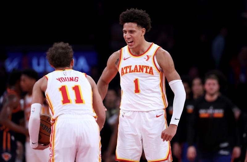 Trae Young of the Atlanta Hawks celebrates the win with teammate Jalen Johnson after a game against the New York Knicks.
