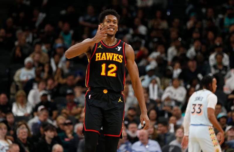 e'Andre Hunter #12 of the Atlanta Hawks reacts after scoring against the San Antonio Spurs in the second half at Frost Bank Center on December 19, 2024 in San Antonio, Texas.