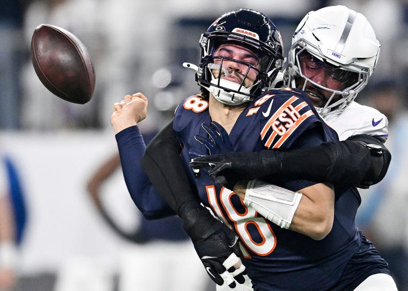 Jonathan Greenard #58 of the Minnesota Vikings strip sacks Caleb Williams #18 of the Chicago Bears during the first quarter at U.S. Bank Stadium on December 16, 2024 in Minneapolis, Minnesota. Minnesota recovered the ball on the play.