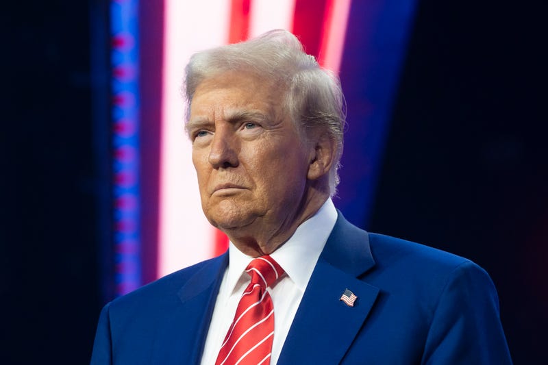 Donald Trump looks on