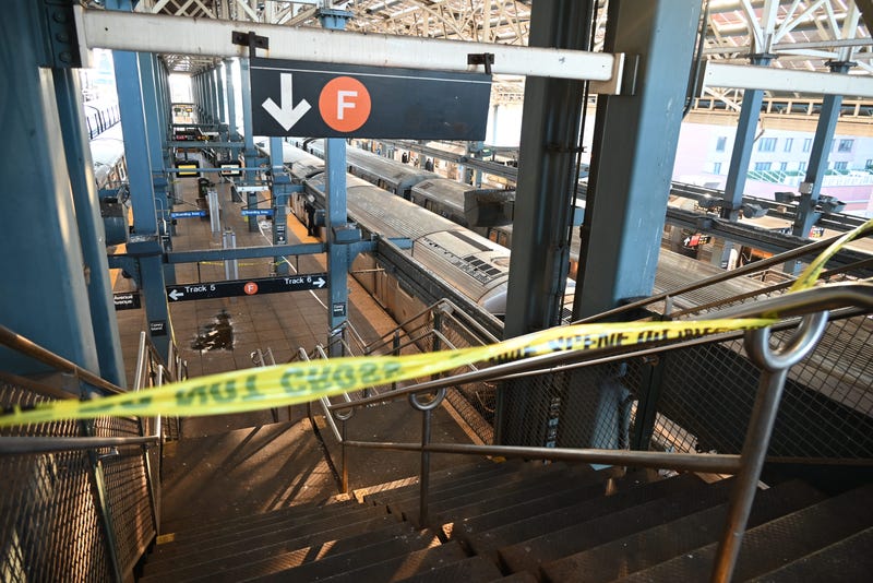 Police investigate at the Coney Island-Stillwell Avenue station in Brooklyn after a woman aboard a subway car was set on fire on Dec. 22, 2024