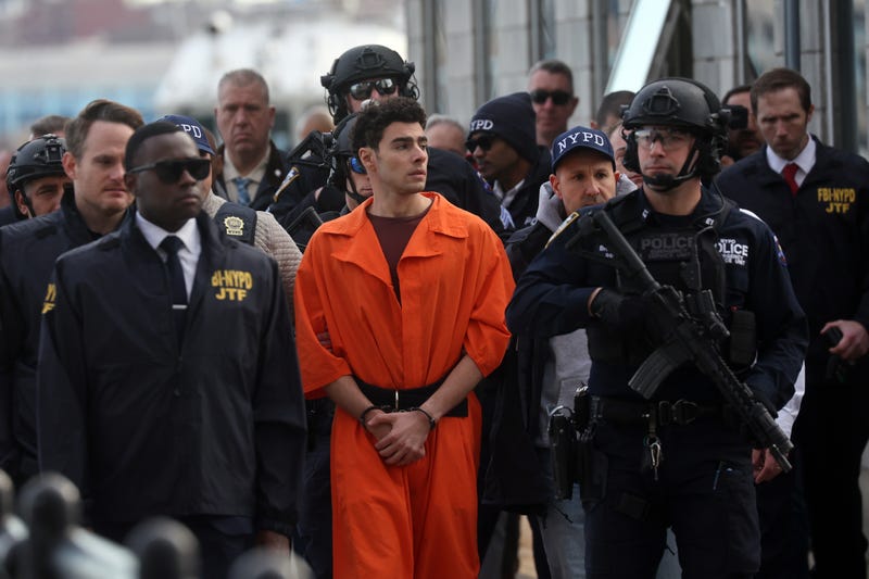 Luigi Mangione, suspect in the killing of UnitedHealthcare CEO Brian Thompson in New York City, arrives at a heliport with members of the NYPD on December 19, 2024