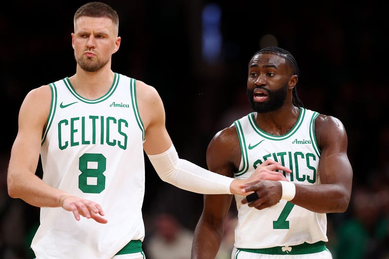 Jaylen Brown #7 of the Boston Celtics is held back by Kristaps Porzingis #8 after recieving a technical foul during the second half of the game against the Chicago Bulls at TD Garden on December 19, 2024 in Boston, Massachusetts. The Bulls defeat the Celtics 117-108.