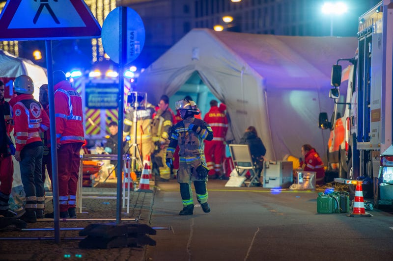 Police vans and ambulances stand next to the annual Christmas market in the city center following a possible terror incident on December 20, 2024 in Magdeburg, Germany.