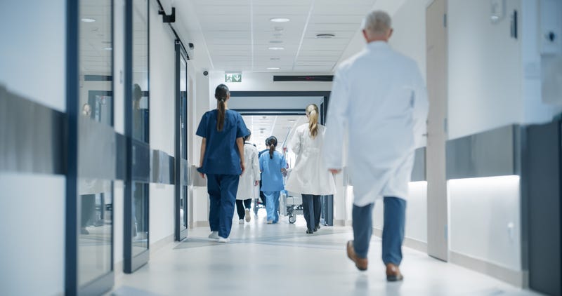 Medical staff walking out of a hospital 