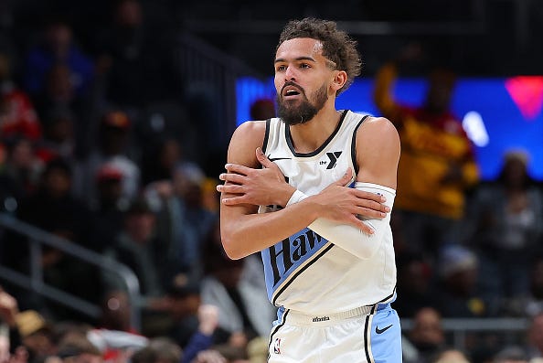 Trae Young displaying he has trust in his teammates