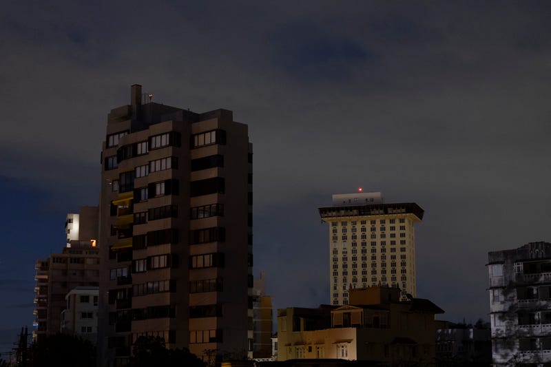 Residential buildings are seen in the dark in San Juan, Puerto Rico after a major power outage hit the island on December 31, 2024