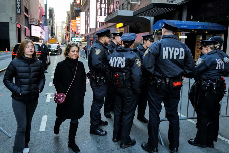 NYPD officers stand watch in Times Square in New York City ahead of the New Year's Eve celebration on December 31, 2024. 