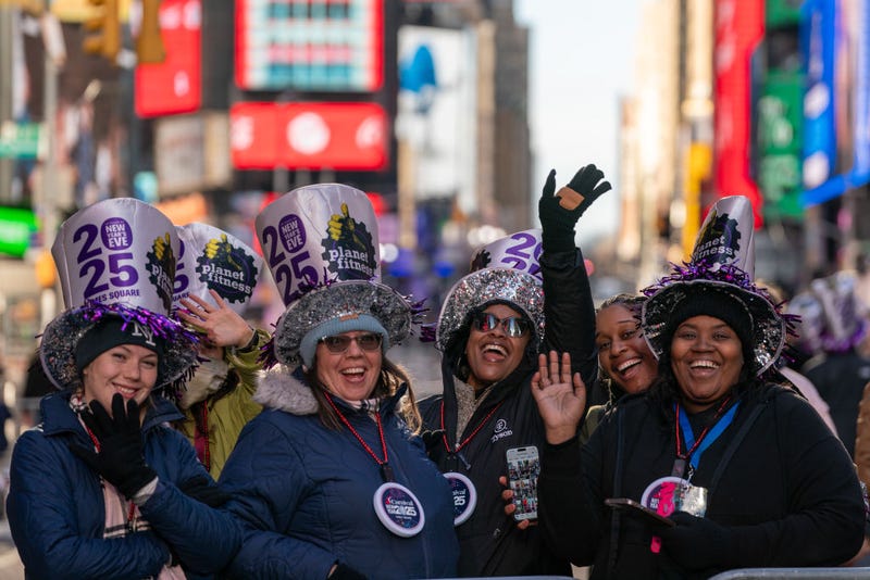 A small crowd of revelers celebrate in Times Square prior to the New Year's Eve celebrations on December 31, 2024.