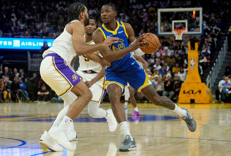 Jonathan Kuminga (#00) is guarded by Gabe Vincent (#7) during the second half at Chase Center on December 25, 2024 in San Francisco, California.