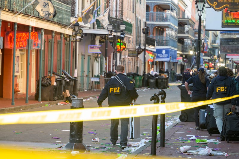 FBI investigators arrive at the scene on Bourbon Street