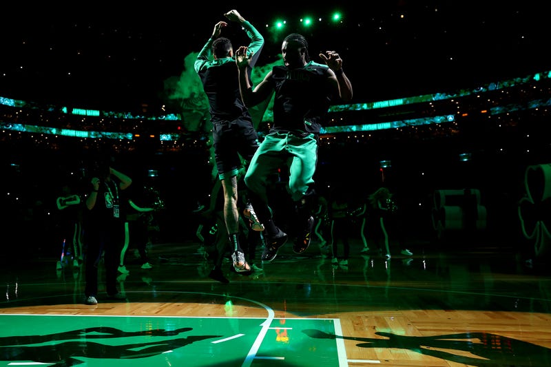 Jayson Tatum #0 and Jaylen Brown #7 of the Boston Celtics jump together after being announced before the game against the Indiana Pacers at TD Garden on December 27, 2024 in Boston, Massachusetts.