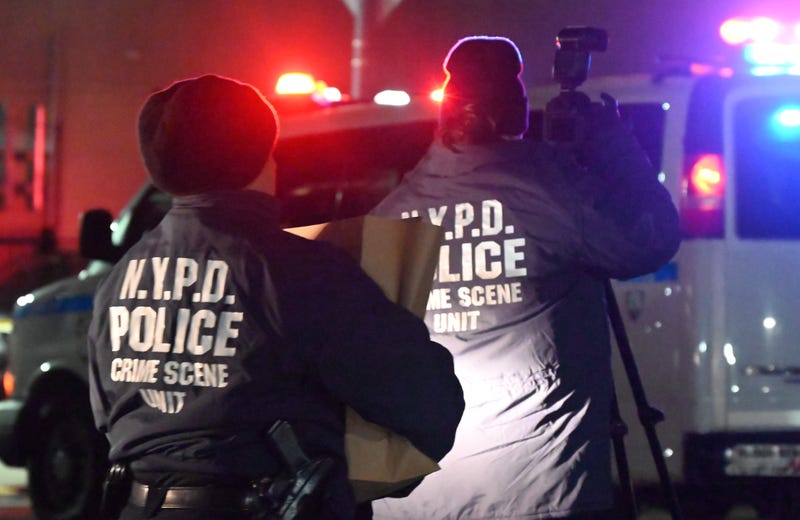 NYPD investigators at a crime scene in the Bronx