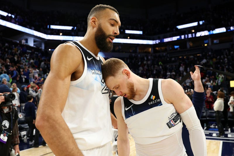 Rudy Gobert #27 (L) and Donte DiVincenzo #0 of the Minnesota Timberwolves interact after the game against the San Antonio Spurs at Target Center on December 29, 2024 in Minneapolis, Minnesota. The Timberwolves defeated the Spurs 112-110.