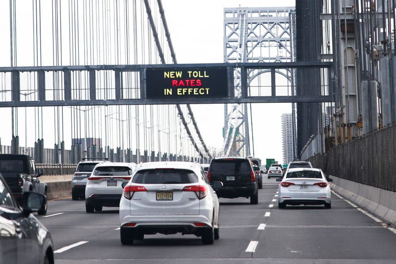 Cars pass under a congestion pricing warning sign on George Washington Bridge as congestion pricing takes effect in New York City on Jan. 5, 2024. 