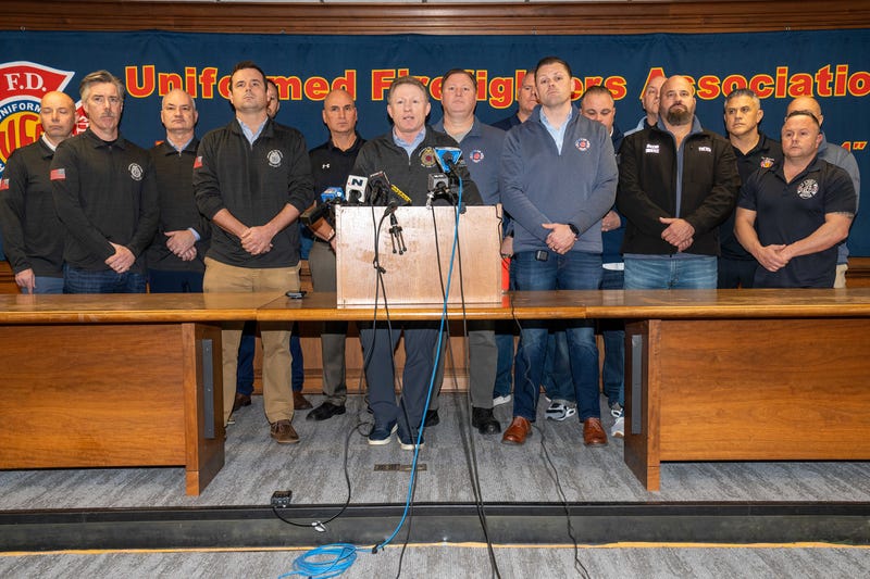 James Brosi (center), president of the Uniformed Fire Officers Association, is joined by Andrew Ansbro, president of the Uniformed Firefighters Association, and firefighters at a press conference Sunday, Jan. 5, 2025, to publicize concerns about congestion pricing