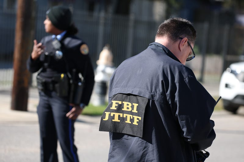 FBI and New Orleans Police are seen outside a house fire on Mandeville Street that may be connected to the mass casualty Bourbon Street attack where at least ten people were killed when a person allegedly drove into the crowd in the early morning hours of New Year's Day on Jan. 1, 2025, in New Orleans, Louisiana.