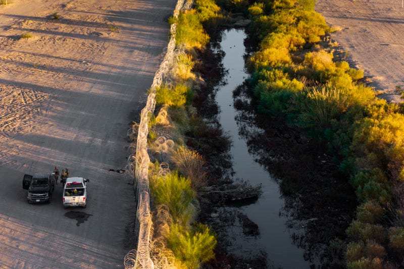 In an aerial view, National Guard soldiers speak together while patrolling the U.S. side of the Rio Grande on Jan. 1, 2025, in El Paso, Texas.