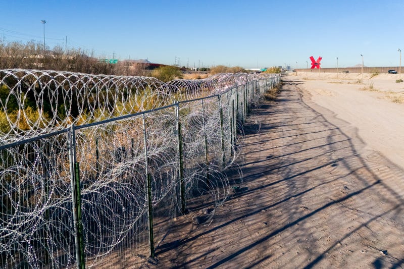 Federal agents in Laredo have arrested a father and son accused of smuggling hundreds of firearms, magazines, and rounds of ammunition across the U.S.-Mexico border.