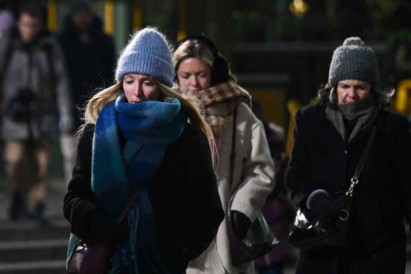 People walk in Midtown Manhattan during freezing cold temperatures on Jan. 8, 2025