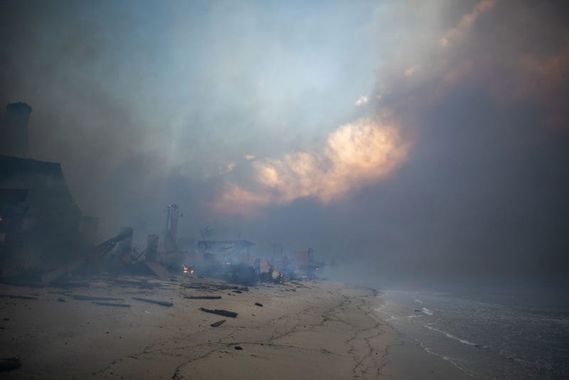 Iconic beach homes smolder from the Palisades Fire along the Pacific Coast Highway amid a powerful windstorm on January 8, 2025 in Malibu, California. Fueled by intense Santa Ana Winds, the Palisades Fire has grown to over 2,900 acres and 30,000 people have been ordered to evacuate while a second major fire continues to burn near Eaton Canyon in Altadena.