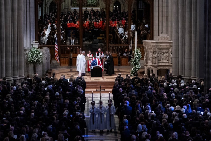 clergy pray over the Carter casket